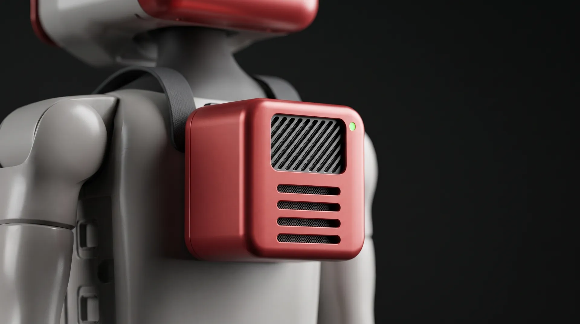 The red Milo backpack, a compact module with a ventilated grille and a small green status light, strapped to the robot’s back.